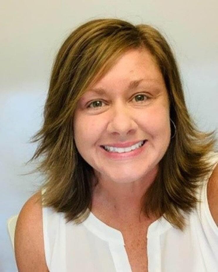 Wall Residences Residential Regional Director Angela Newman standing outside