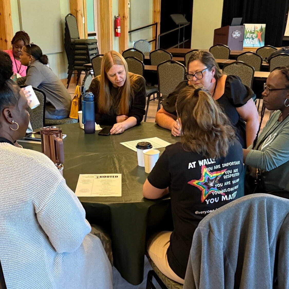 Group of staff gathered at a table together