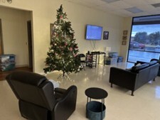 Sitting area with couches and a Christmas tree in the Waynesboro Star Center