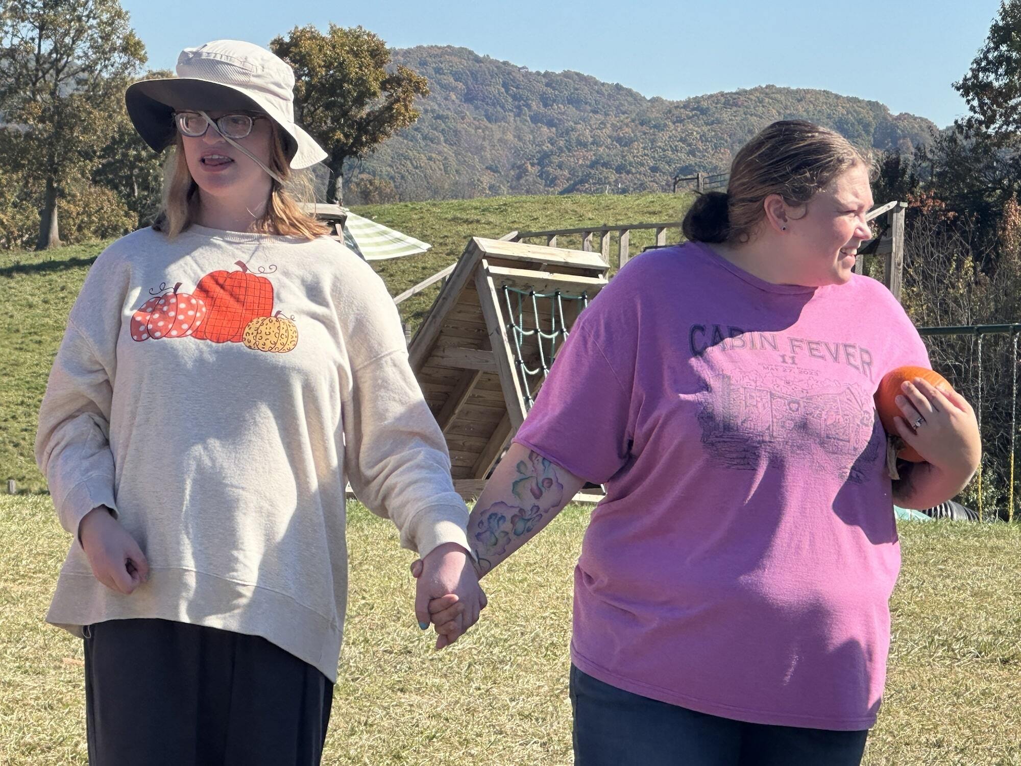 Holding hands pumpkin season